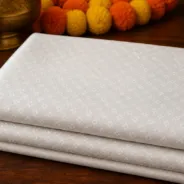 KashiFab Cotton Jacquard Zari Banarasi Fabric folded on table - Banaras fabric cover