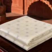 KashiFab Cotton Jacquard Zari Banarasi Fabric folded on table - Banaras fabric cover