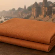 KashiFab Banarasi Pure Matka Silk folded on table - Banaras fabric cover