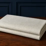 KashiFab Banarasi Pure Matka Silk folded on table - Banaras fabric cover
