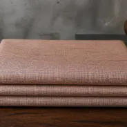 KashiFab Banarasi Pure Matka Silk folded on table - Banaras fabric cover