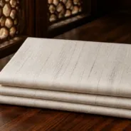 KashiFab Banarasi Pure Matka Silk folded on table - Banaras fabric cover