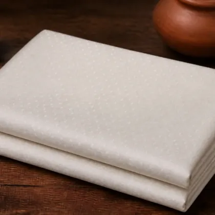 KashiFab Banarasi Pure Munga Zari Meena Buti folded on table - Banaras fabric cover