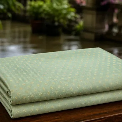 KashiFab Pure Resham Spun Meena Brocade folded on table - Banaras fabric cover