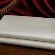 KashiFab Pure Resham Spun Meena Brocade folded on table - Banaras fabric cover
