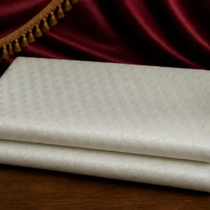 KashiFab Pure Resham Spun Meena Brocade folded on table - Banaras fabric cover