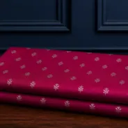 KashiFab Banarasi Pure Raw Silk Zari Booti folded on table - Banaras fabric cover