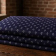 KashiFab Banarasi Pure Raw Silk Zari Booti folded on table - Banaras fabric cover