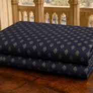 KashiFab Banarasi Pure Raw Silk Zari Booti folded on table - Banaras fabric cover