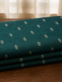 KashiFab Banarasi Pure Raw Silk Zari Booti folded on table - Banaras fabric cover