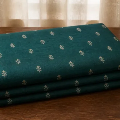KashiFab Banarasi Pure Raw Silk Zari Booti folded on table - Banaras fabric cover