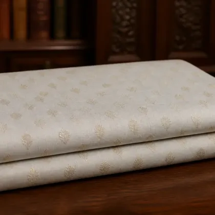 KashiFab Banarasi Pure Raw Silk Zari Booti folded on table - Banaras fabric cover