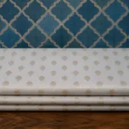 KashiFab Banarasi Pure Raw Silk Zari Booti folded on table - Banaras fabric cover