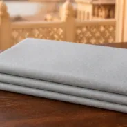 KashiFab Banarasi Pure Resham Cotton Meena Jacquard folded on table - Banaras fabric cover