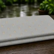 KashiFab Banarasi Pure Resham Cotton Meena Jacquard folded on table - Banaras fabric cover