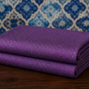 KashiFab Banarasi Pure Resham Cotton Meena Jacquard folded on table - Banaras fabric cover