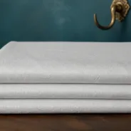 KashiFab Banarasi Pure Resham Cotton Meena Jacquard folded on table - Banaras fabric cover