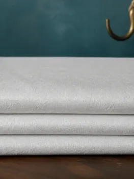 KashiFab Banarasi Pure Resham Cotton Meena Jacquard folded on table - Banaras fabric cover