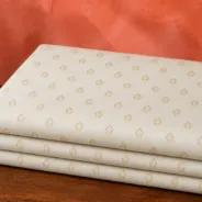 KashiFab Banarasi Pure Resham Cotton Meena Jacquard folded on table - Banaras fabric cover