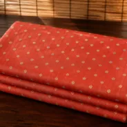 KashiFab Banarasi Resham Zari Meena Brocade folded on table - Banaras fabric cover