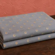 KashiFab Banarasi Resham Zari Meena Brocade folded on table - Banaras fabric cover