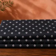 KashiFab Banarasi Resham Zari Meena Brocade folded on table - Banaras fabric cover