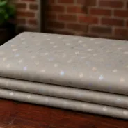 KashiFab Banarasi Resham Zari Meena Brocade folded on table - Banaras fabric cover