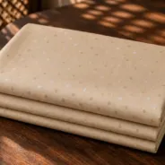 KashiFab Banarasi Resham Zari Meena Brocade folded on table - Banaras fabric cover