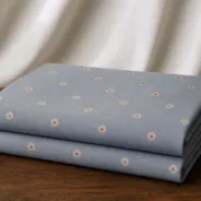 KashiFab Banarasi Resham Zari Meena Brocade folded on table - Banaras fabric cover