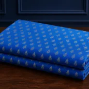 KashiFab Banarasi Resham Zari Meena Brocade folded on table - Banaras fabric cover