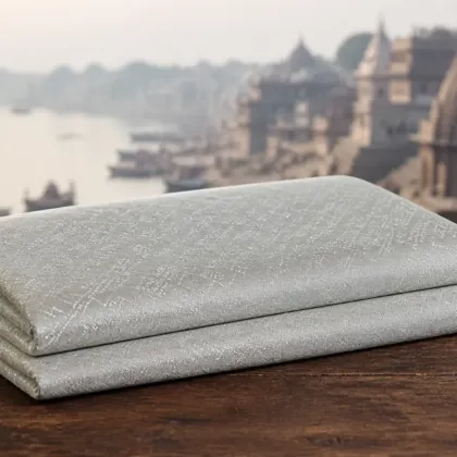 KashiFab Pure Resham Spun Silk Banarasi Jacquard folded on table - Banaras fabric cover