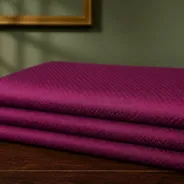KashiFab Pure Resham Spun Silk Banarasi Jacquard folded on table - Banaras fabric cover