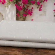 KashiFab Banarasi Sartan Zari Meena Brocade folded on table - Banaras fabric cover