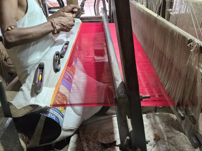 KashiFab Banarasi silk hand loom setup in Varanasi - weaver producing pink silk fabric wholesale